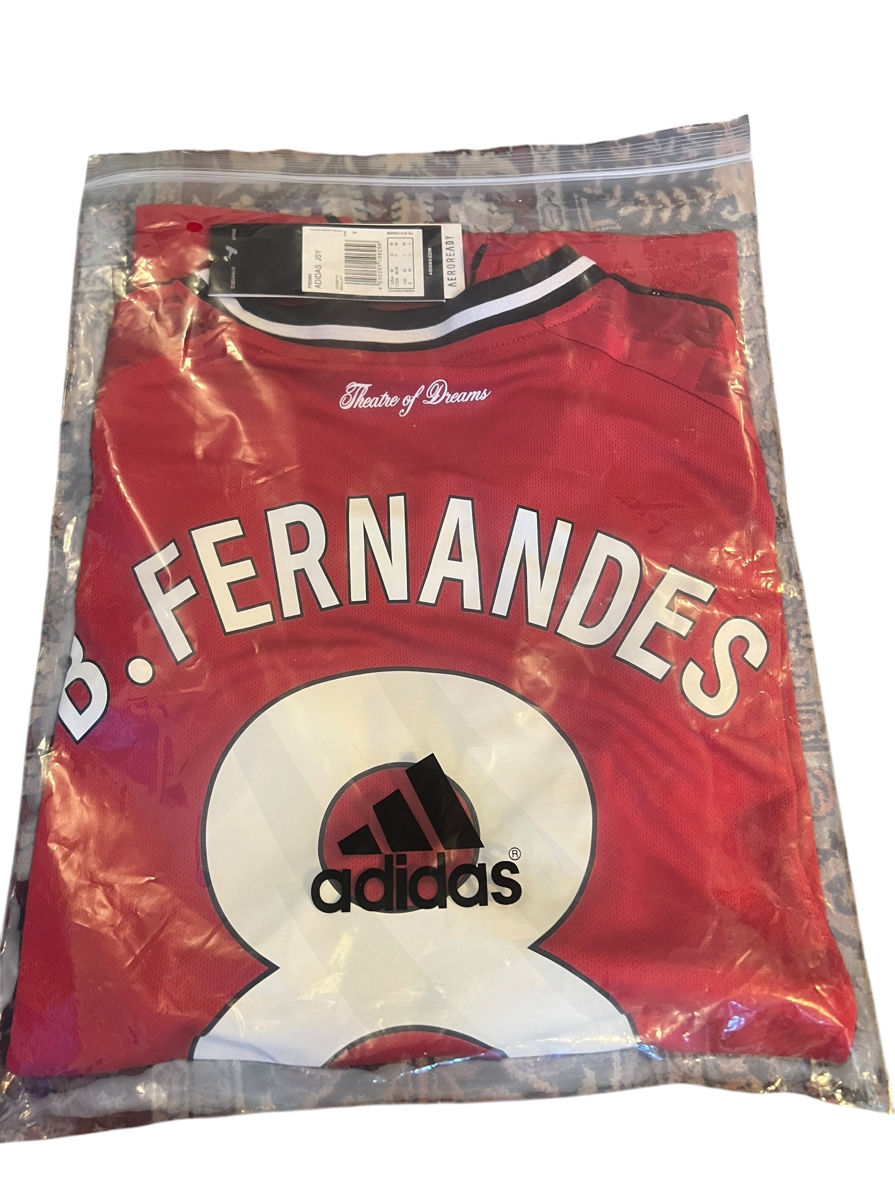 rm memorabilia Manchester United Bruno Fernandes home football shirt in red with number 8 and Theatre of Dreams detail