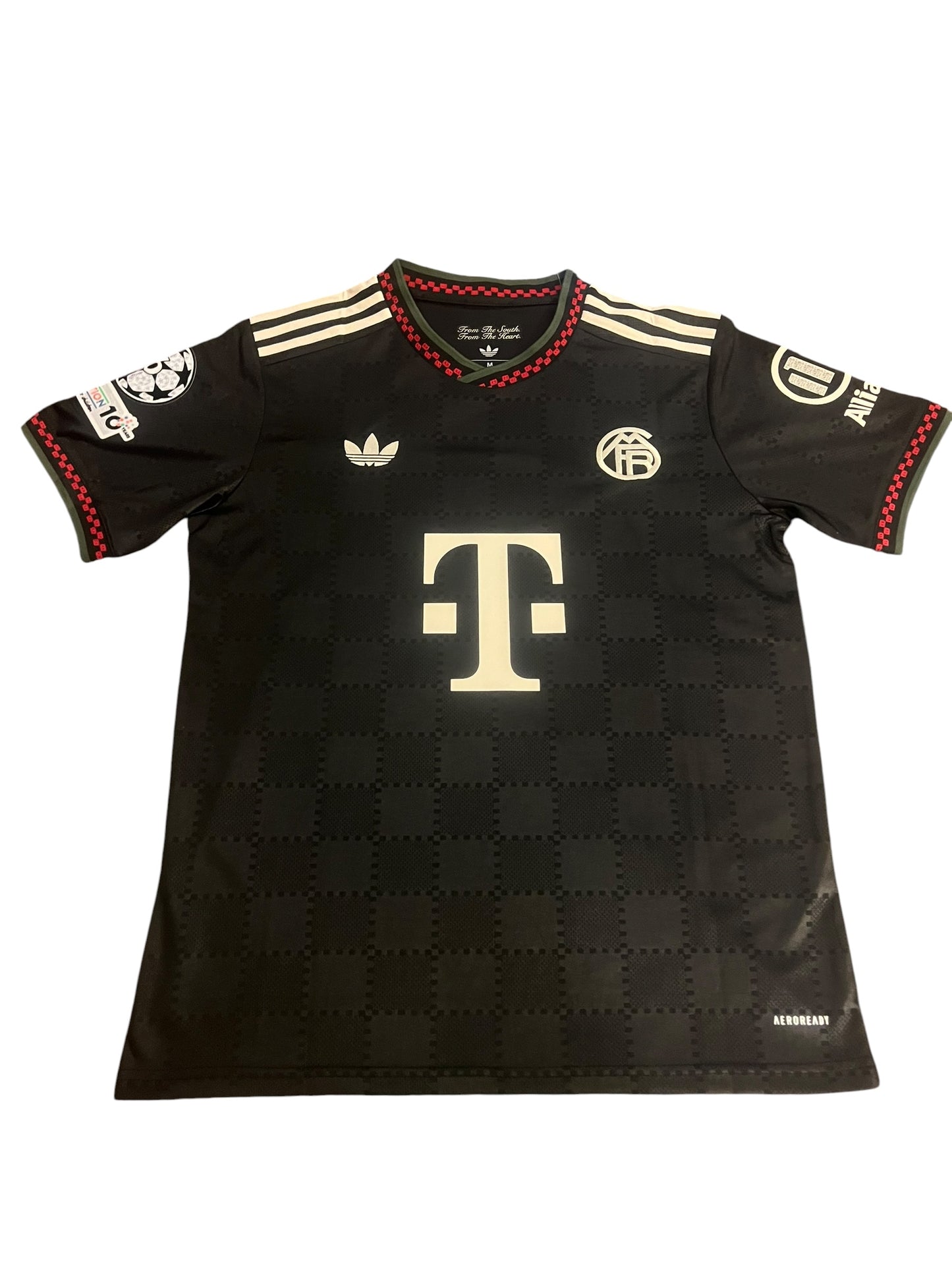 rm memorabilia FC Bayern Munich Michael Olise black football jersey with checkered pattern and white detailing