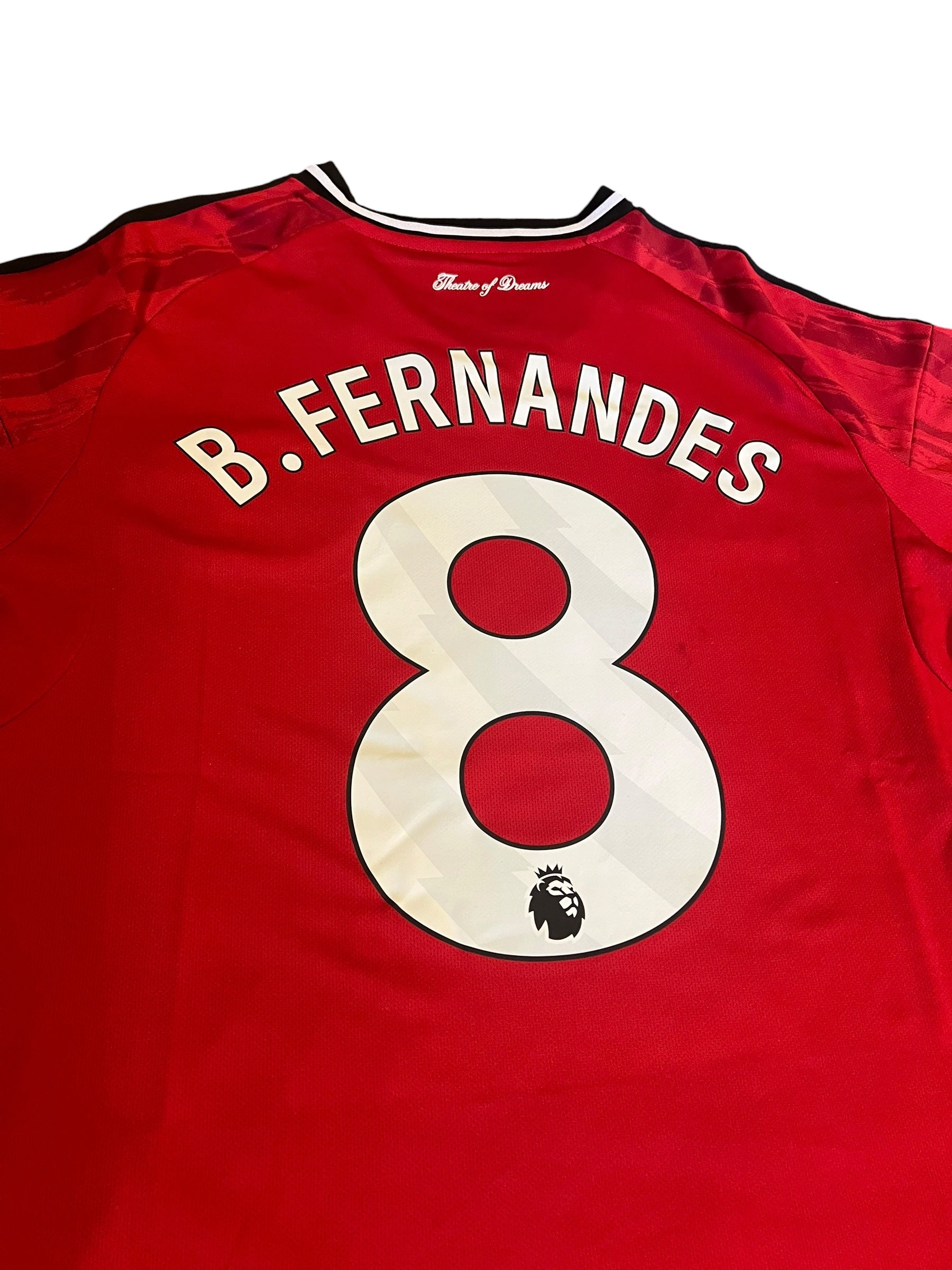 rm memorabilia Manchester United home shirt with Bruno Fernandes name and number 8 on the back in red and white