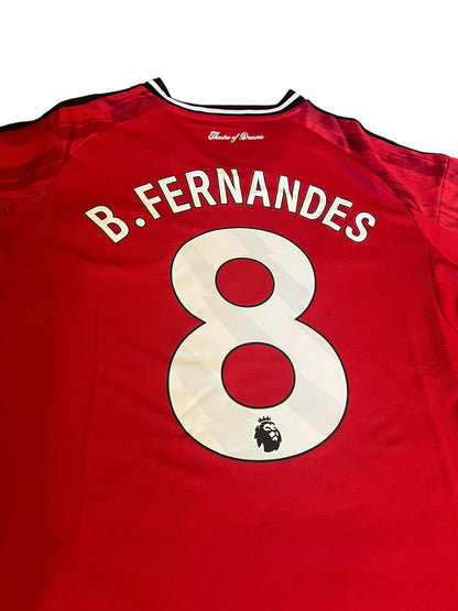 rm memorabilia Manchester United home shirt with Bruno Fernandes name and number 8 on the back in red and white
